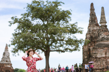 A woman traveling in Chaiwatthanaram Temple one of the land marks of  Ayutthaya