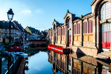 Market exterior in romantic Colmar in France during winter time. Place called little Venice.