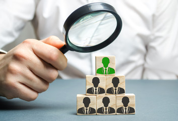 Find a talented employee. Businessman searching for new employees. Staff recruitment. Select a person in the team. Attracting people to work. Human Resource Management. Recruiting. Magnifying glass
