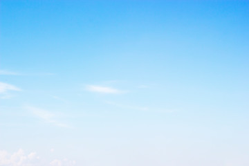Fluffy blue sky background and white clouds soft focus, and copy space