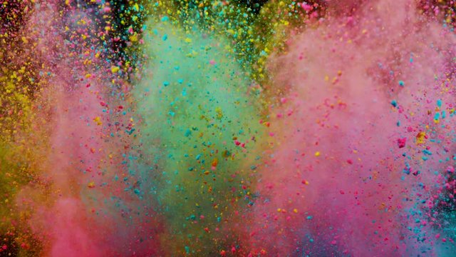 Super slowmotion shot of color powder explosion isolated on black background.