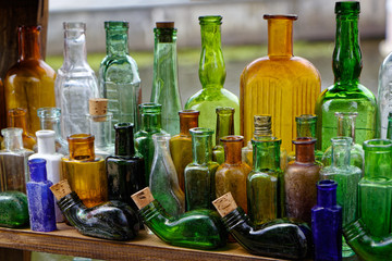 Old colored empty glass bottles are scarce