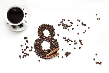 Coffee beans with cinnamon on a white background, March 8 cup of coffee