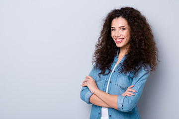 Profile side view portrait of her she nice cute pretty charming winsome attractive lovely cheerful cheery wavy-haired girl folded arms isolated over gray pastel background