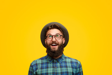 Excited man with beard looking up