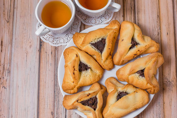 Baked sugar food dessert on wooden plate. Cookies and pastry