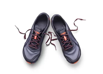 Foto op Plexiglas Top view of gray and orange trainers isolated on a white background. © Duncan Andison