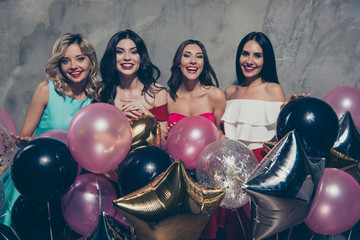 Portrait of nice-looking lovely chic elegant attractive glamorous gorgeous cheerful ladies many different shine baloons festive over gray concrete wall © deagreez