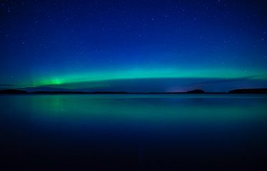 Fototapeta na wymiar Northern lights background in Farnebofjarden national park in Sweden.