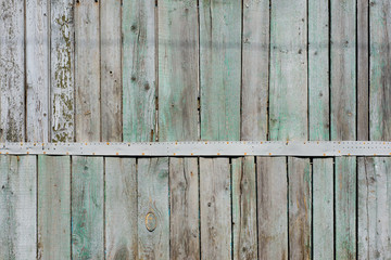 Wooden background with paint residues and rusty nails