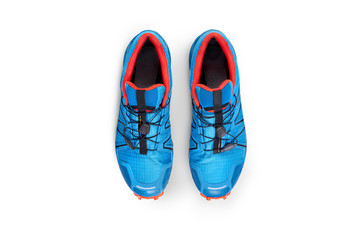 Top view of blue and orange trainers isolated on a white background.
