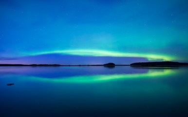 Fototapeta na wymiar Northern lights background in Farnebofjarden national park in Sweden.