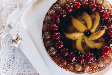 Cherry delicious tasty baked pie with fresh fruits on white plate