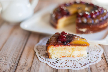 Cherry delicious tasty baked pie with fresh fruits on white plate