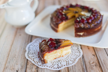 Cherry delicious tasty baked pie with fresh fruits on white plate