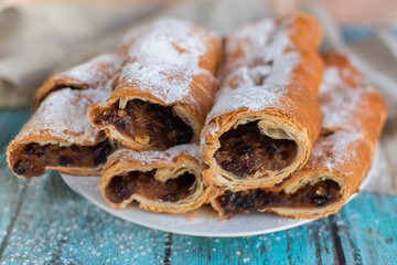 Baked cookies and cakes on wooden table 