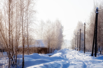 Beautiful winter landscape - rural road on a Sunny day