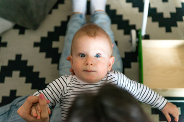 Mother holding beautiful baby boy