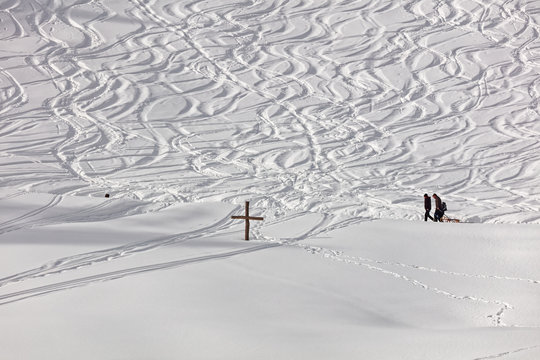 Sledders and snow track