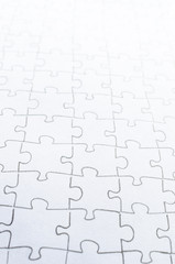 Assembled puzzle on light background.