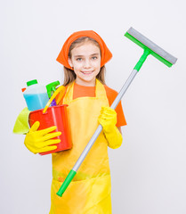 Little girl with mop and cleaning supplies in bucket