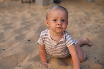 Fototapeta premium Happy little boy with light after swimming in the sea