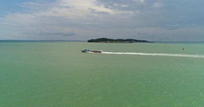 Aerial footage Sea passenger ferry in the sea against the island