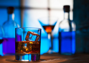 whiskey glass ice whisky ba rblue colour  background