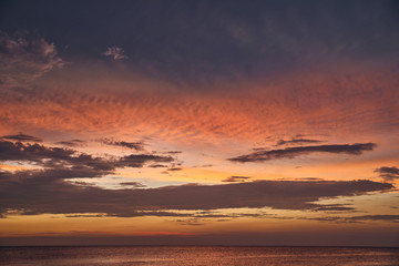Fototapeta na wymiar Beautiful sunset on the sea and sky with clouds.