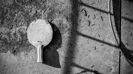 Old Equipment for table tennis - racket. Ping pong. legs top view. male wear Green gumshoes or...