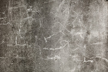 Cracks in the concrete wall as an abstract background