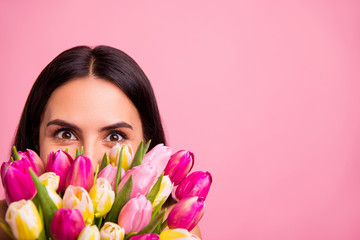Close-up cropped portrait of her she nice cute attractive lovely winsome charming cheerful cheery brunette latin lady hiding behind colorful flowers florist advert isolated on pink pastel background