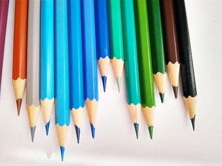 Color pencils on white background close up
