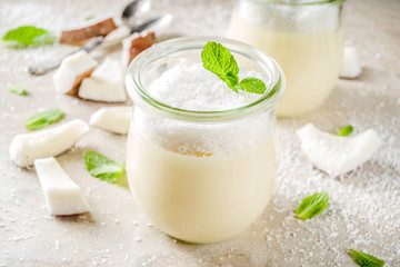 Obraz na płótnie Canvas Vegan coconut panna cotta dessert in glass jar