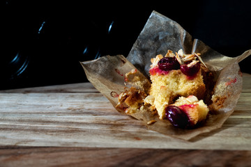 muffins on wooden board with dark background