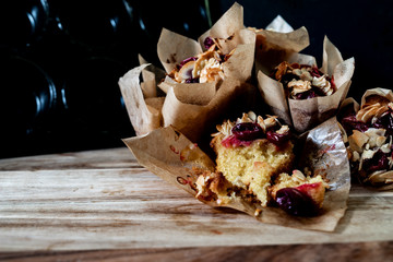 muffins on wooden board with dark background