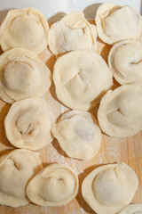 Raw and fresh is stuck on the dumplings are on the Board