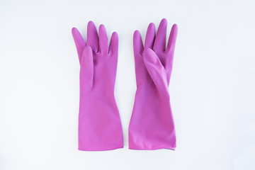 Purple rubber gloves isolated on white.