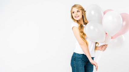 happy attractive woman holding pink and white air balloons on white background with copy space