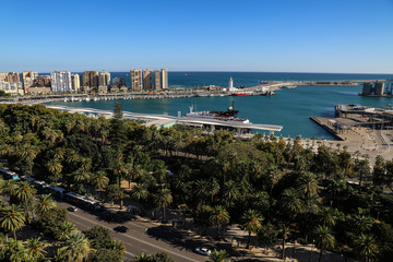 View of the big paseo del parque of Málaga and the skyline of the harbour in the background