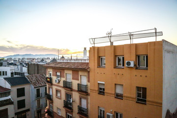 Yellow buildings with a sunny sky