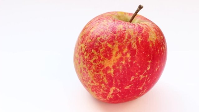 Grape Fuji apples on a white background
