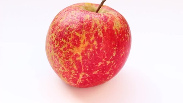 Grape Fuji apples on a white background