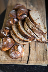 Sliced sourdough bread on wooden shelf