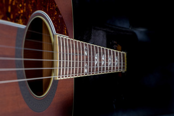 Obraz na płótnie Canvas electric acoustic guitar with mahogany deck and string guitar close up