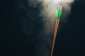 Two wood arrow. Beautiful smog background. Medieval weapons are handmade.