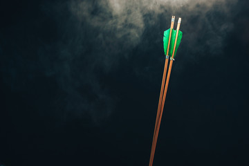 Two wood arrow. Beautiful smog background. Medieval weapons are handmade.