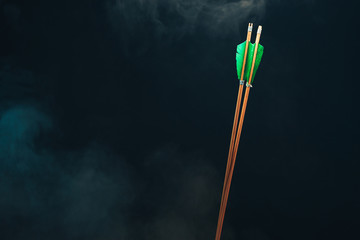 Two wood arrow. Beautiful smog background. Medieval weapons are handmade.