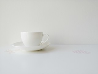 white cup of coffee with white background