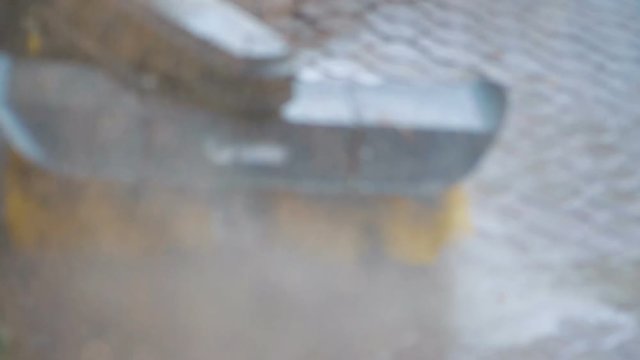 Paving cleaner splashing the water in slow motion 180fps